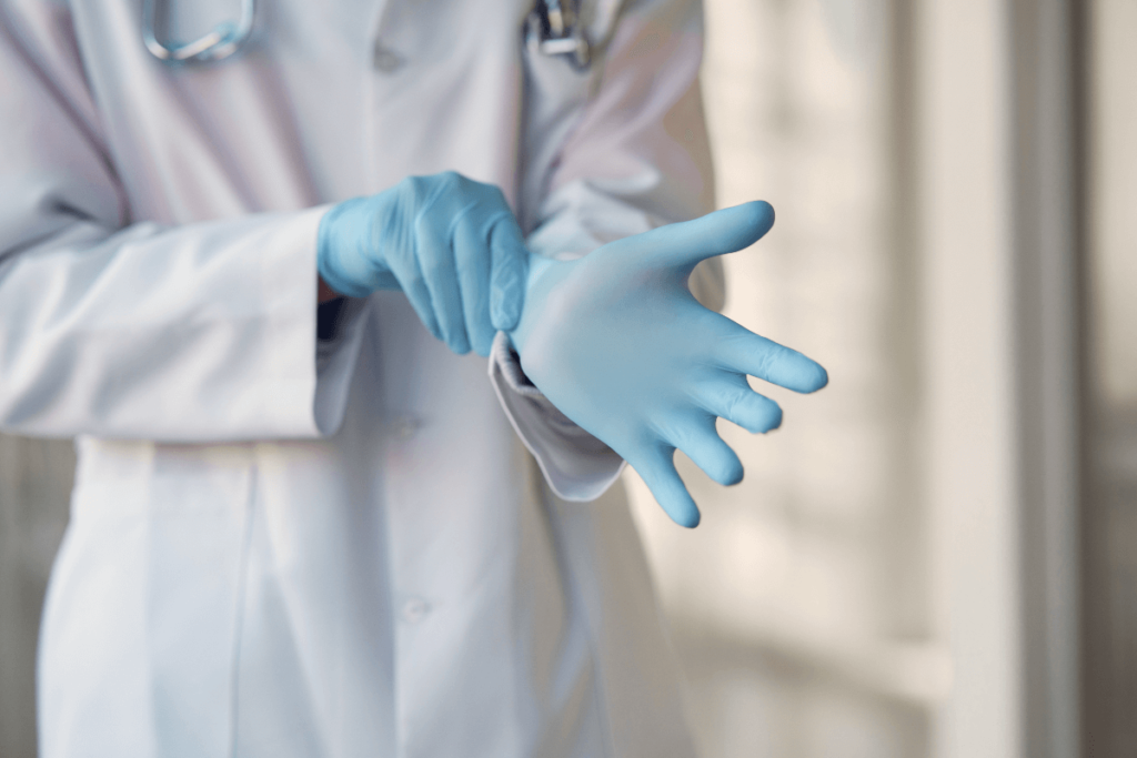 Doctor putting on gloves. Can you sue for misdiagnosis?