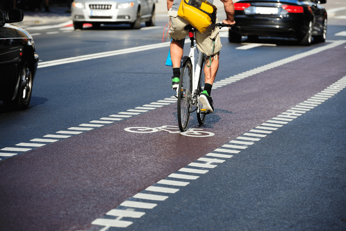 cyclist riding with traffic