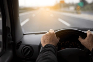 What Is the Leading Cause of Vehicle Accidents Person driving down the road Image
